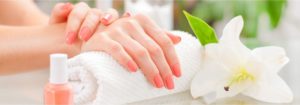 woman's hands with perfect manicure at beauty salon